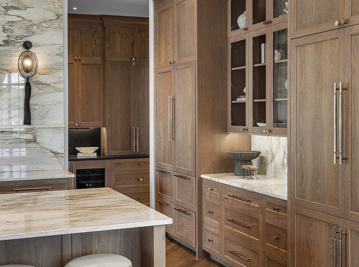 Custom kitchen pantry with glass-front cabinets and integrated storage in Nashville home